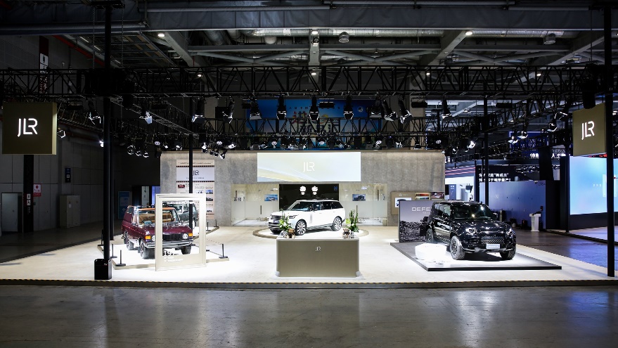 A car showroom with a few carsDescription automatically generated